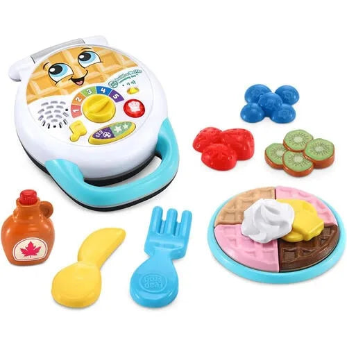 Interactive toy waffle maker with control panel and blue, red, kiwi-style pieces
