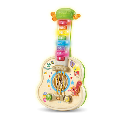 Wooden guitar toy with green neck, numbered bars, star decals, and music buttons