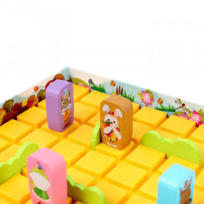Junior board game board closeup with yellow tiles, character frames, green and blue wall parts