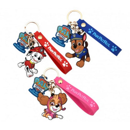 Three Paw Patrol keychains with blue, red, and pink straps and dog character charms
