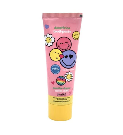 Smiley toothpaste tube, pink with heart and face illustrations, yellow base