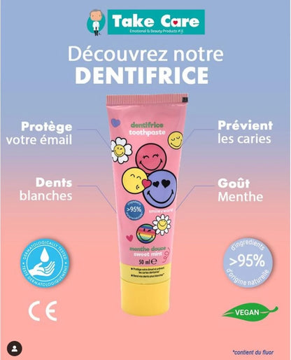Smiley toothpaste tube with pink body, yellow base, and cute face graphics