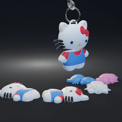 Hello Kitty 3D keychain, white cat charm with blue outfit and red bow on silver ring