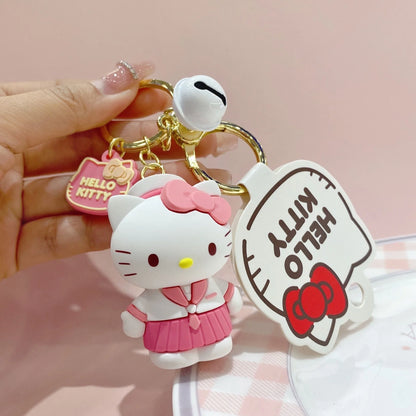 Hello Kitty 3D keychain charm, white cat figure with pink outfit on gold keyring
