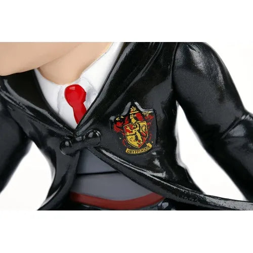 Harry Potter 4-inch figure close-up, black robe with Gryffindor crest and red tie