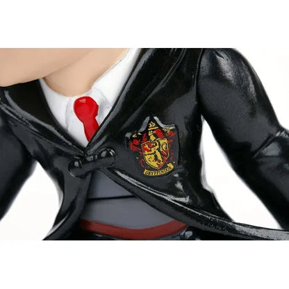 Harry Potter 4-inch figure close-up, black robe with Gryffindor crest and red tie