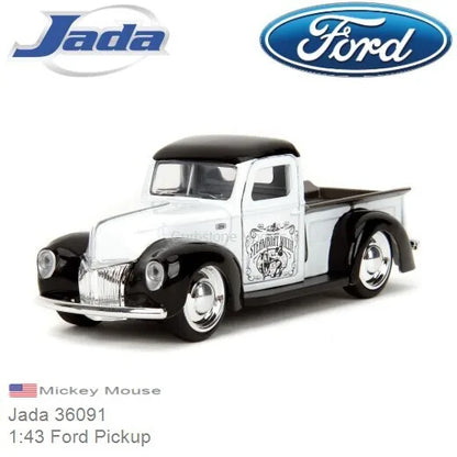 White and black die-cast pickup truck model with character graphic on door