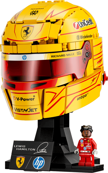 Yellow racing helmet with clear visor and Ferrari shield logo accents