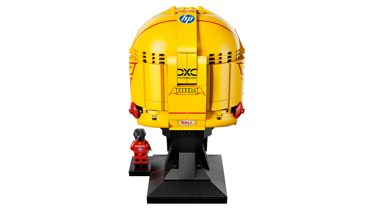 Front view of yellow racing helmet model on black display stand