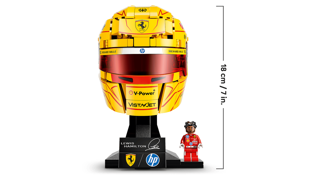 Front view of yellow racing helmet model on black stand with small figure
