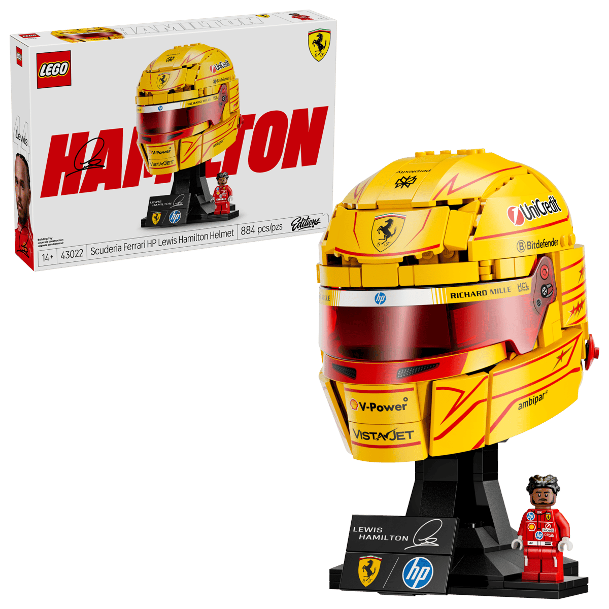 Boxed yellow racing helmet model on display stand with minifigure, front view