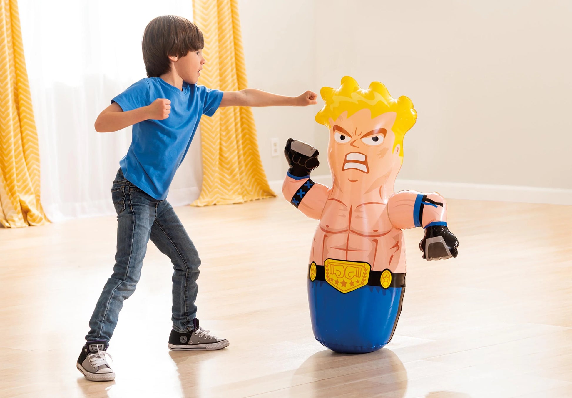 Inflatable boxing bop bag with yellow-haired fighter, standing upright during play