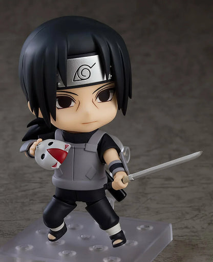 Ninja chibi action figure holding a white-and-red mascot and a sword, gray-and-black ANBU outfit