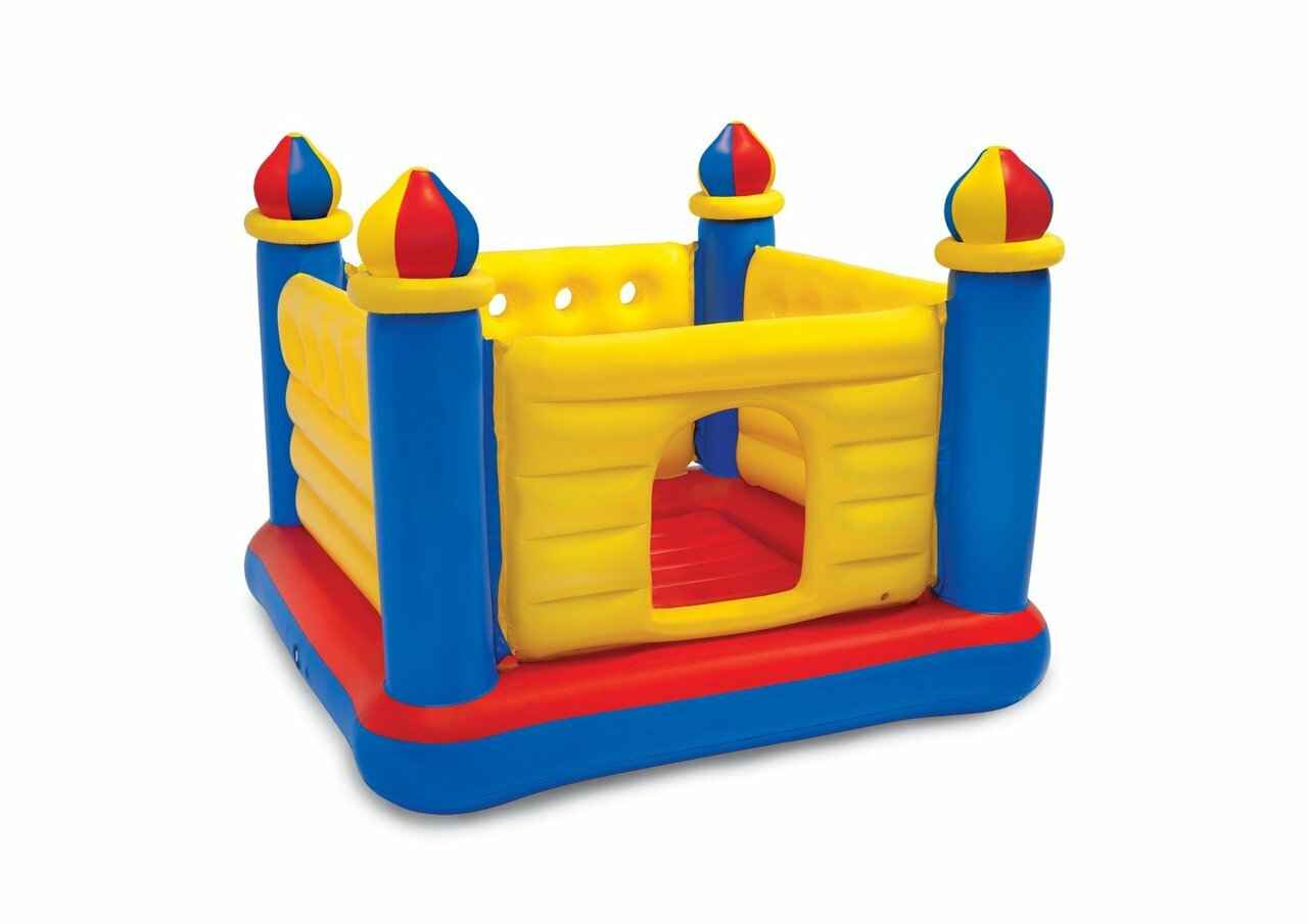 Inflatable castle bouncer with yellow walls, blue turrets, red base, front door opening