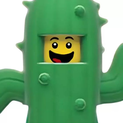 Green cactus keychain light with smiling face in front pocket, dangling keyring