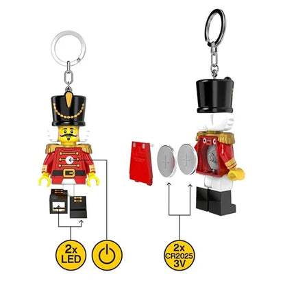Nutcracker keychain light figure with silver key ring, black top hat, red coat and white hands
