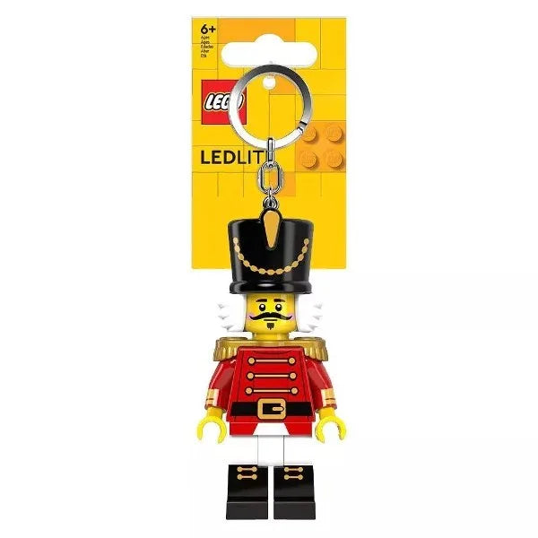 Nutcracker keychain light with black top hat and red uniform, silver key ring