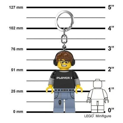 Keychain light minifigure with headphones and glasses on size chart, metal ring