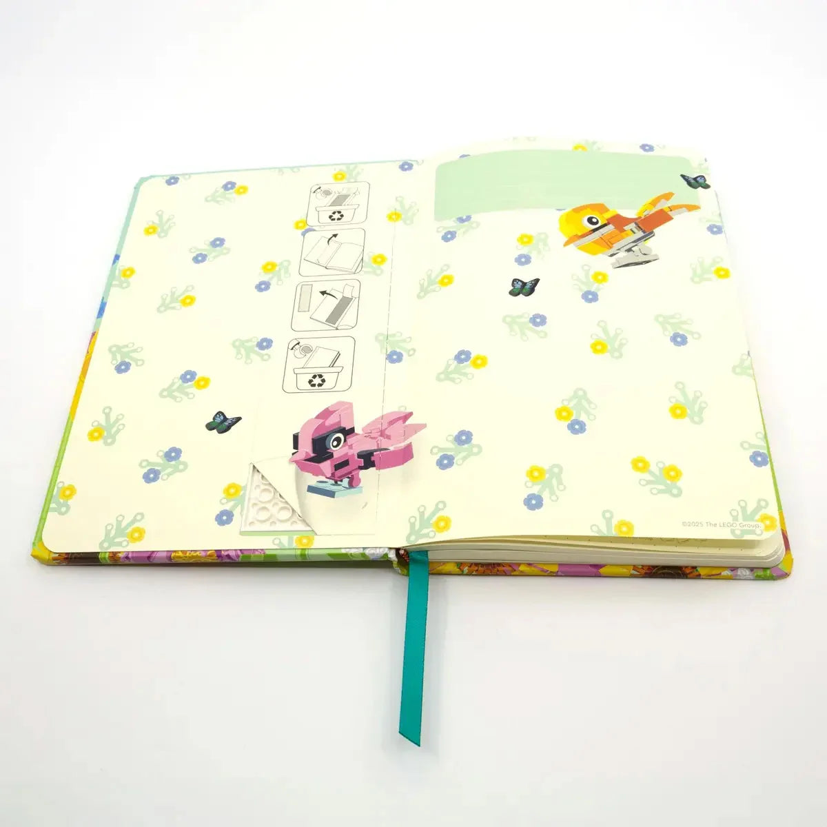 Botanicals notebook with gel pen, open spread with plant icons and a pink bird illustration