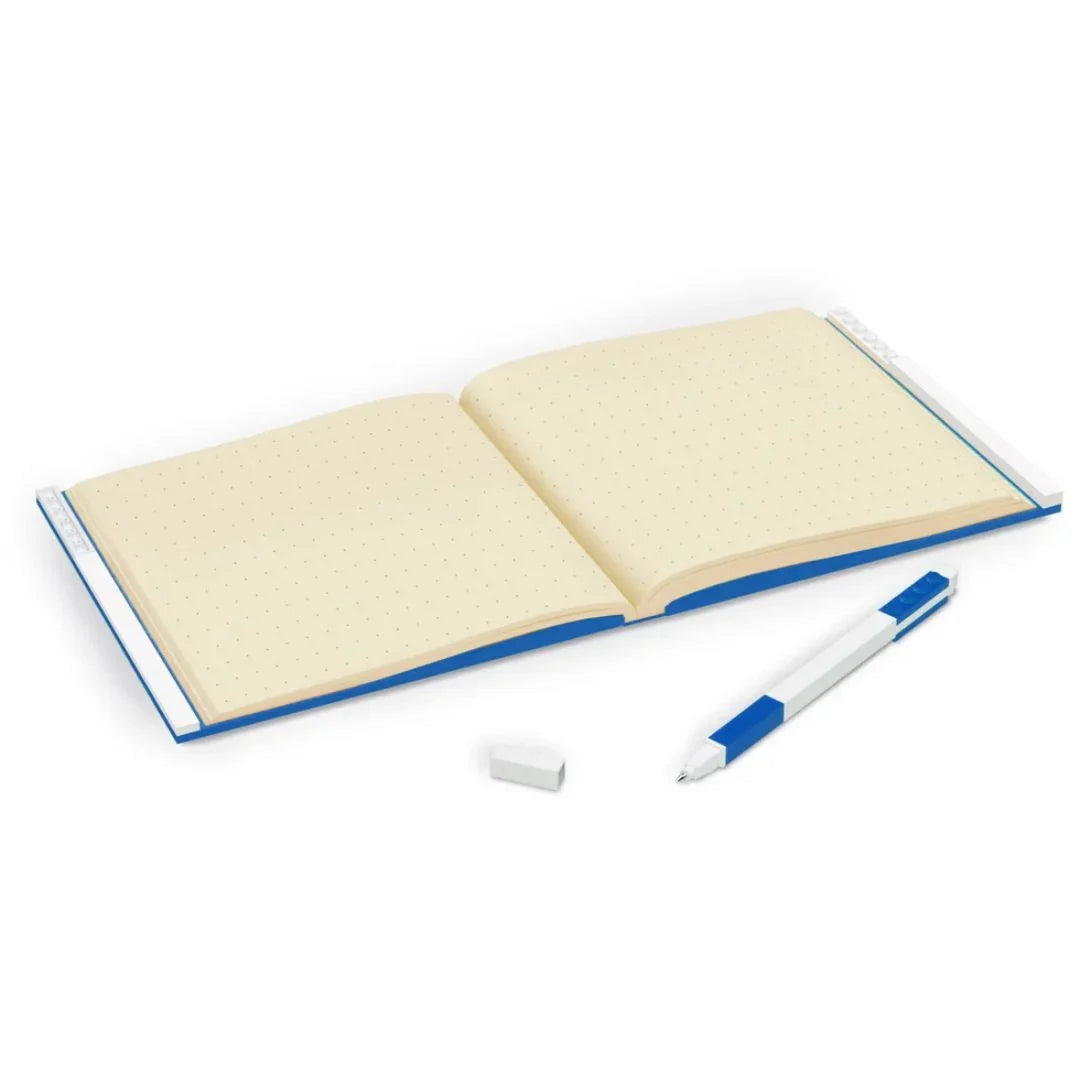 Beige dot-grid notebook with blue edge and gel pen, open