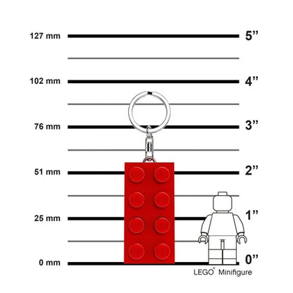 Red keychain light brick with metal ring, shown with size guide