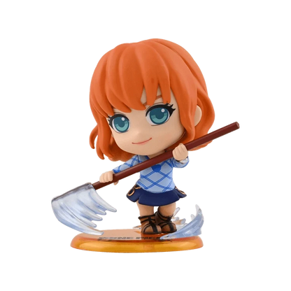 Collectible anime figure with orange hair and blue outfit, holding sword on round base