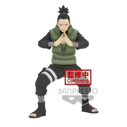 Shikamaru Nara collectible figure in green vest, kneeling with hands together.