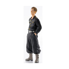 PVC figure of a male character in dark jacket, gray boots, posed standing.