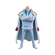 Standing light blue action figure with open cloak and crossed arms