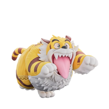 Tiger-themed character figure with open mouth, pink tongue, yellow coat, white mane