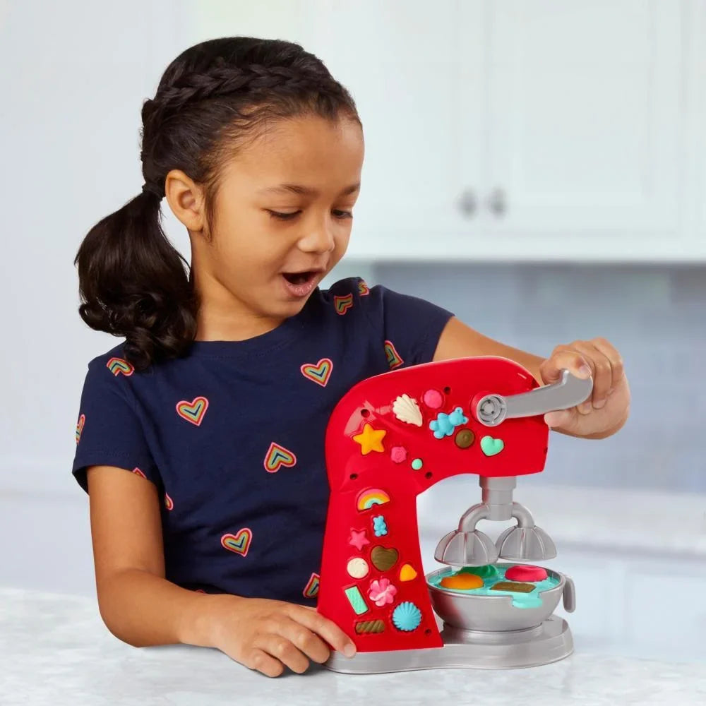 Red toy stand mixer playset with mixing bowl, whisk, and detachable top attachments