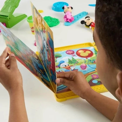 Child pressing dough into a patterned tray with a Mickey story-shape Play-Doh set