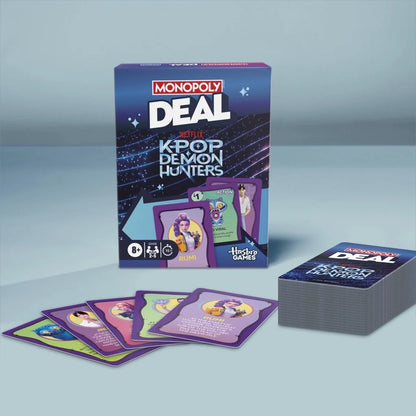 Monopoly Deal Kpop Demon Hunters card game box with spread of cards
