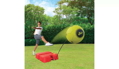 Reflex Swingball set on grass: lime soccer ball, red base rebound launcher and cord