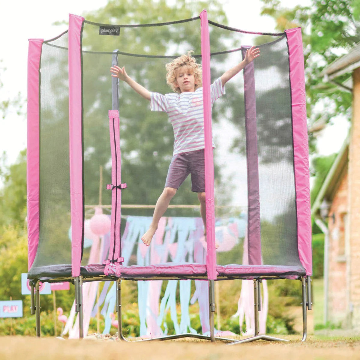 Pink safety-net trampoline with padded mat and metal frame, net enclosure