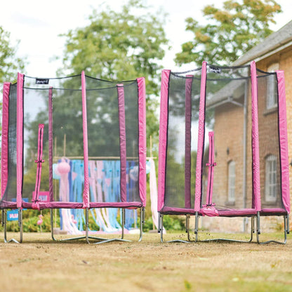 Pink safety-net trampoline with padded rim and steel legs
