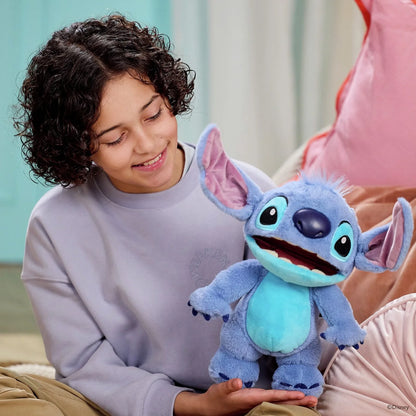 Blue Stitch plush chat puppet held by a child, purple ears and big eyes