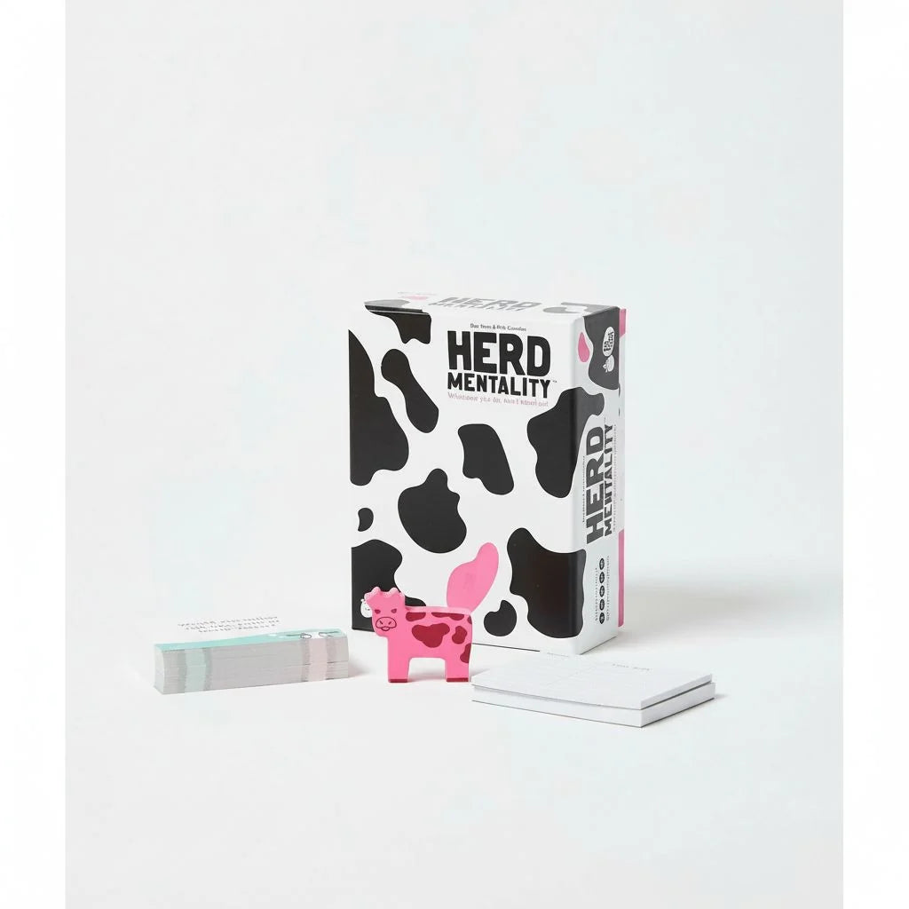 Board game box with Herd Mentality branding, cow-print pieces and card stack
