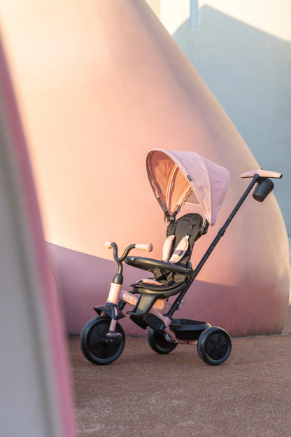 Pink 3-wheel tricycle stroller with canopy, black handlebar and seat