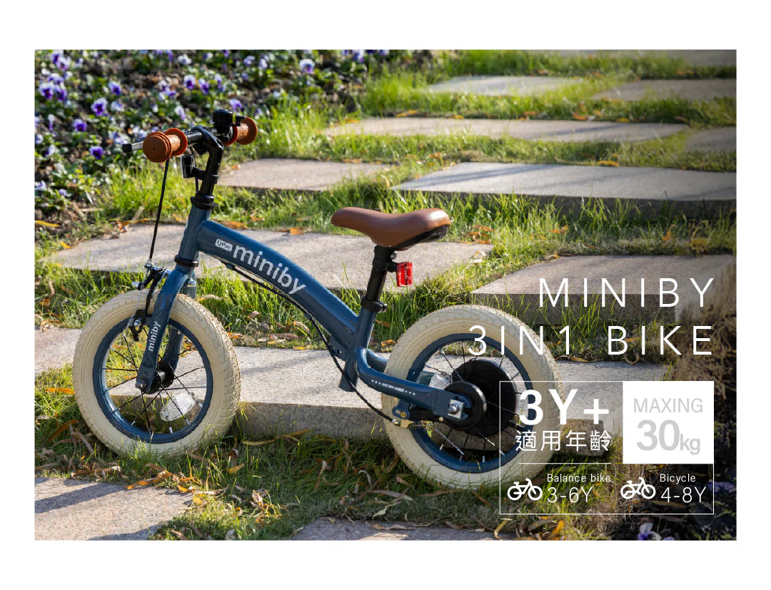 Outdoor view: gray-blue miniby 3in1 balance bike with tan seat and small tires
