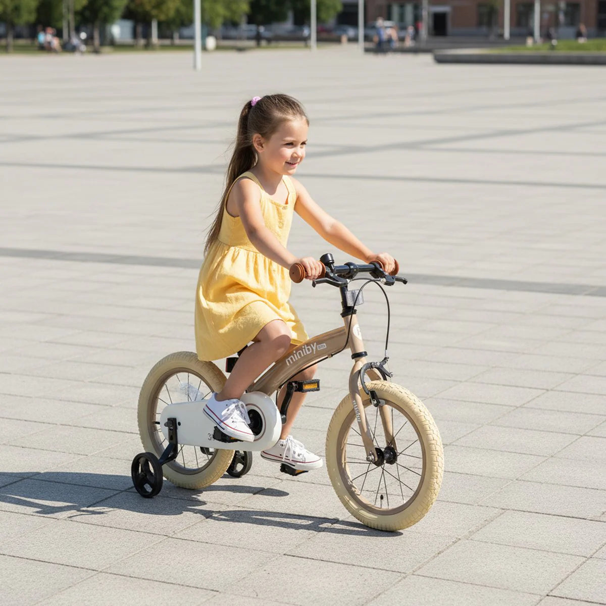 Children's balance bike, tan frame, 12-inch wheels and orange handlebar grips