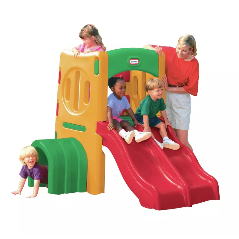 Playground tunnel climber with orange tower, green base, and red slide