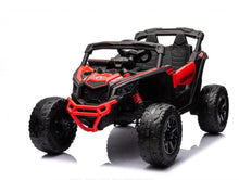 Red and black ride-on UTV with open seats, roll cage, and chunky tires