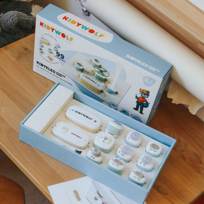 Kidyelec starter electronics kit open box with modules, cables, and component parts