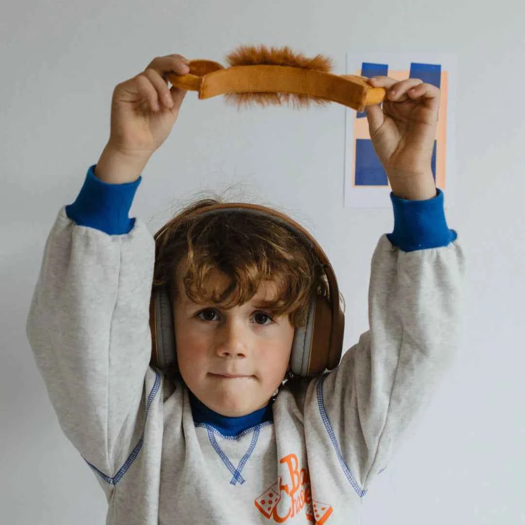 Kids' Bluetooth lion headphones with plush tan headband and rounded ear pads