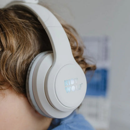White over-ear headphones with logo on earcup and cushioned gray pads
