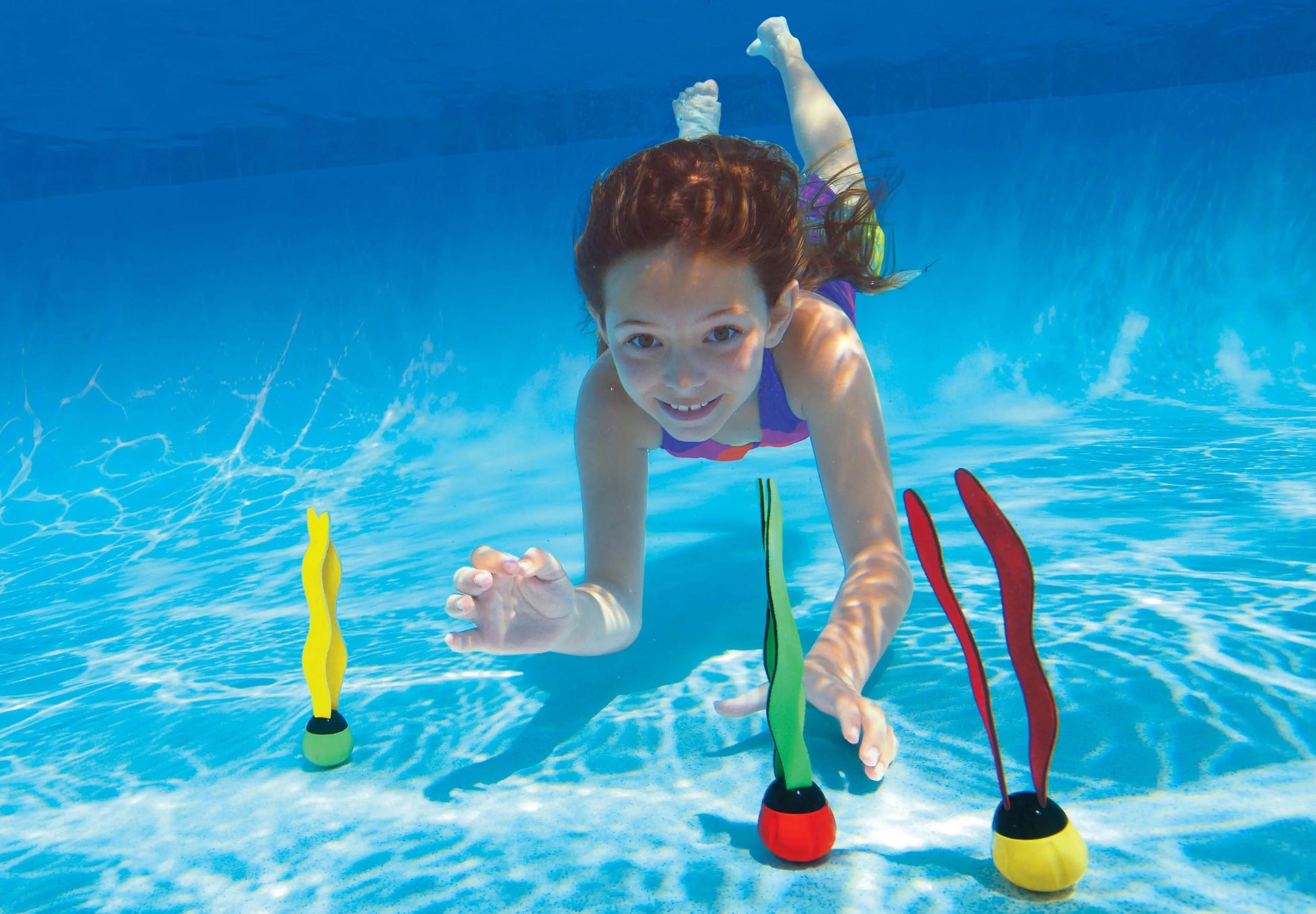 Underwater flippers toy with floating balls in green and red, with yellow pair