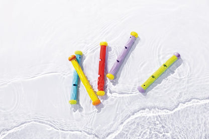 Underwater play sticks floating in water, yellow, light blue, red, and purple