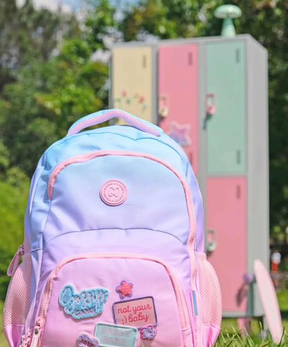 Pastel lavender backpack front with embroidered patches and front zip pocket