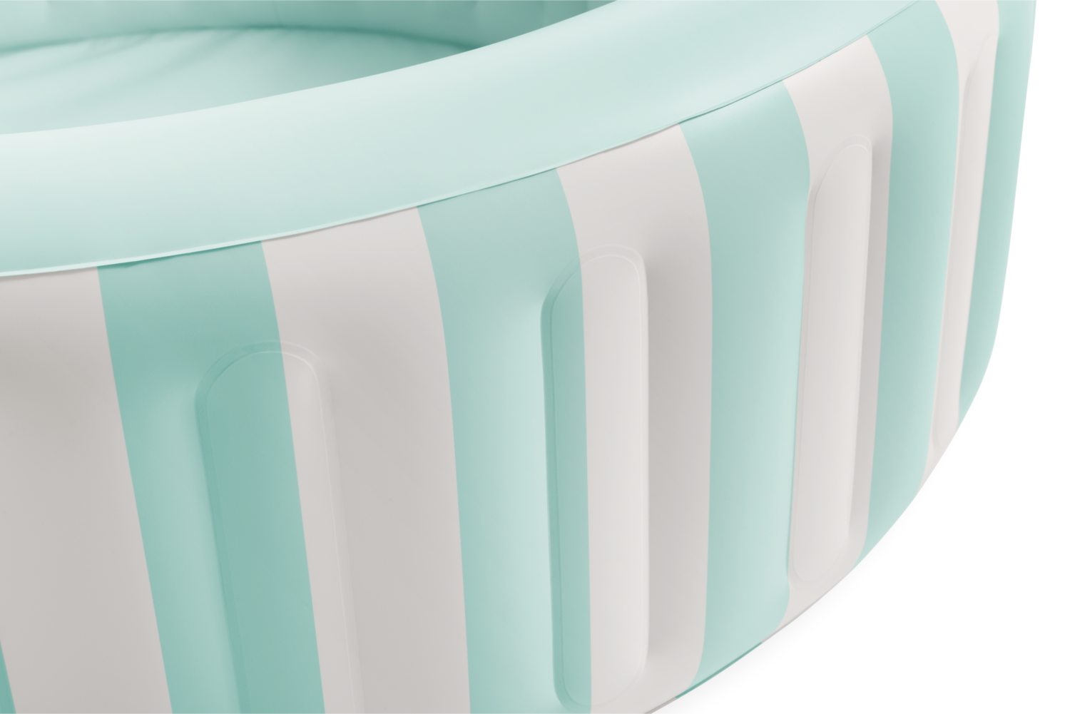 Inflatable pool rim close-up with mint wall, white stripes, and ribbed texture
